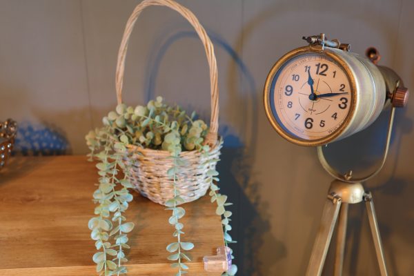standing clock with flower basket
